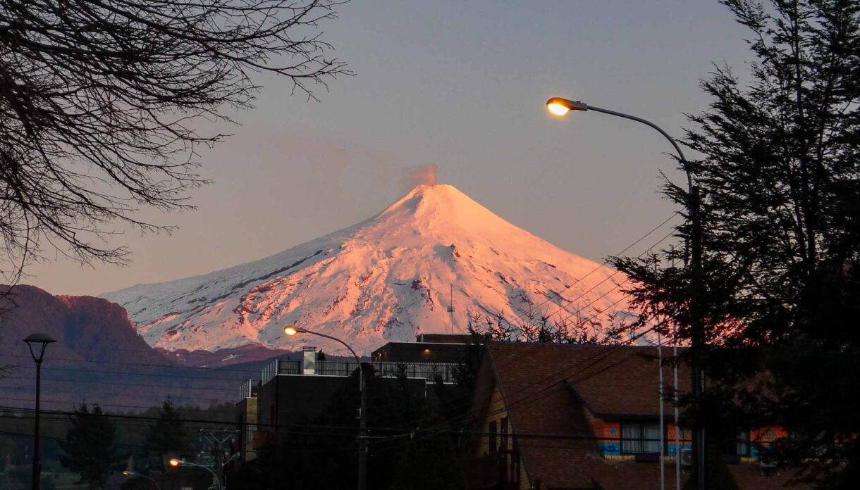 Villarrica Volcano glows pink in the sunrise