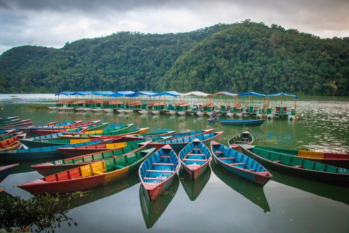 Colourful boats bob on Phewa Lake, Pokhara