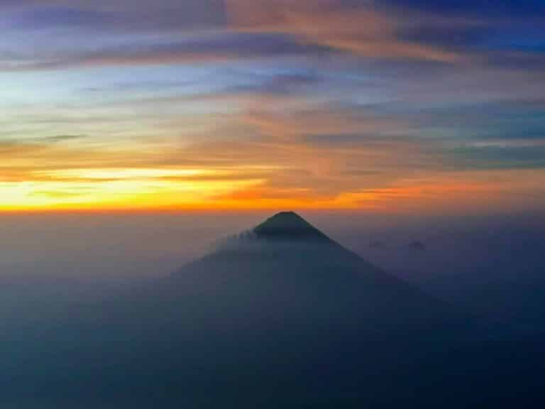 Volcano Agua with the sunrise in the background on the Acatenango Volcano Hike in Guatemala