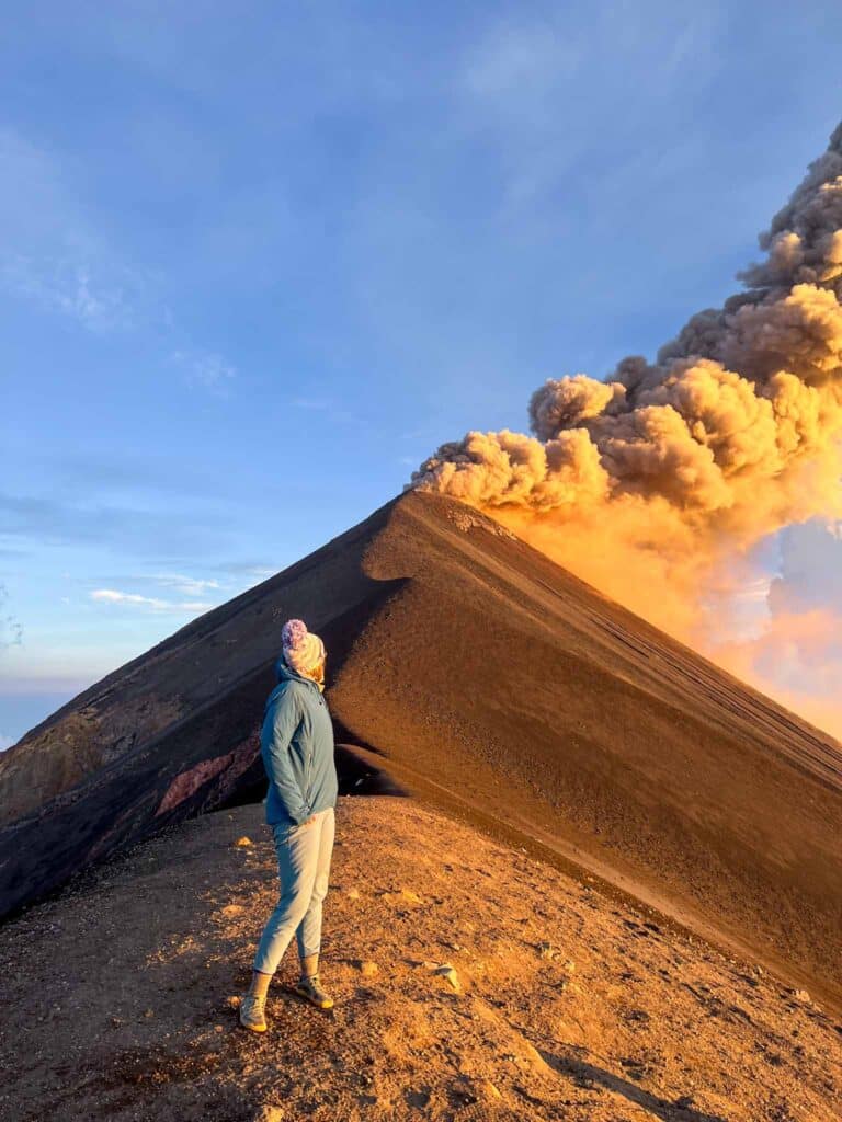 Alice is standing on Volcan Fuego an extra option on the Acatenango Volcano Hike in Guatemala