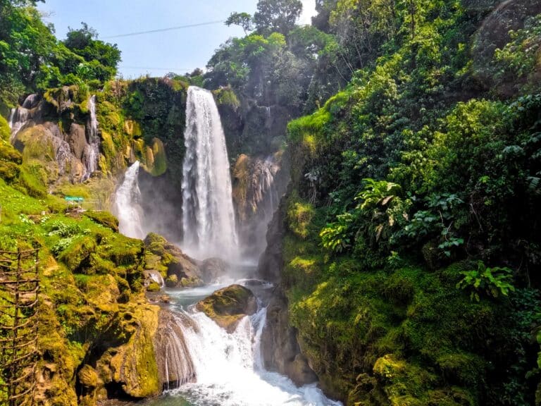 Pulhapanzak Waterfall surrounded by lush greenery